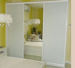White Wardrobe With Mirror In The Bedroom Photo
