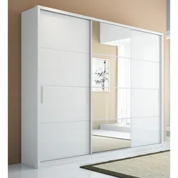 White wardrobe with mirror in the bedroom photo