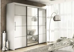 White Wardrobe With Mirror In The Bedroom Photo