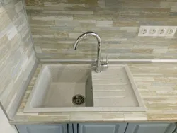 Kitchen faucet made of artificial stone photo