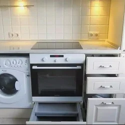 Refrigerator Washing Machine Sink In The Kitchen Photo