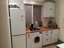 Refrigerator washing machine sink in the kitchen photo