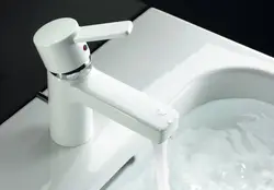White bathroom sink faucet photo