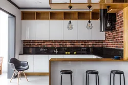 Photo of a kitchen without handles in loft style