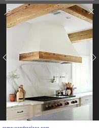Kitchen hood in a wooden house photo