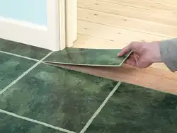 Tiles on wooden floor in bathroom photo