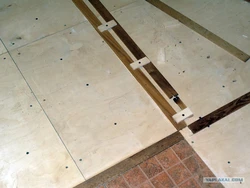 Tiles on wooden floor in bathroom photo
