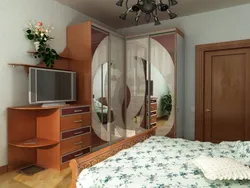 Corner wardrobe in the bedroom with TV photo