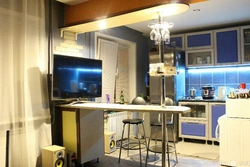 Kitchen With Bar Counter And TV Photo