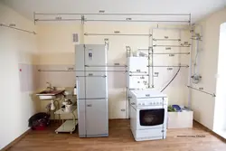 Gas pipe behind the refrigerator in the kitchen photo