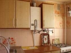 Gas pipe behind the refrigerator in the kitchen photo