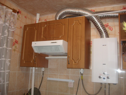 Photo Of A Gas Pipe And Hood In The Kitchen