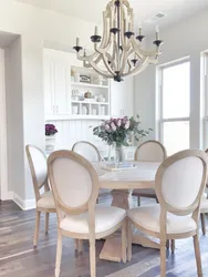 Chairs in the living room photo with a round table