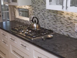 Kitchen countertops photo with black tiles