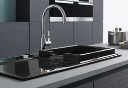 Black Sink And Faucet In The Kitchen Photo