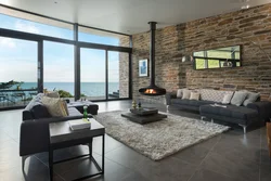 Living room with fireplace and panoramic windows photo