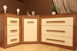 Corner chests of drawers in the bedroom for TV photo