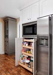 Kitchen refrigerator and oven next to each other photo