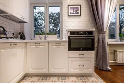 Photo of an oven built into a corner kitchen