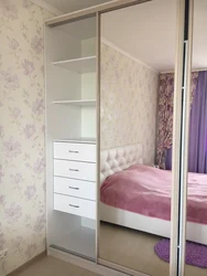 Sliding wardrobes with one mirror in the bedroom photo
