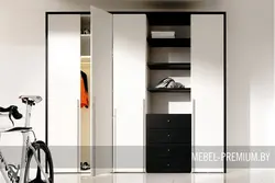Built-in wardrobes with hinged doors in the hallway photo