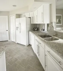 White kitchen with gray marble countertop photo