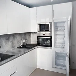 White kitchen with gray marble countertop photo