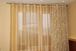 Tulle and curtains in the bedroom with grommets photo