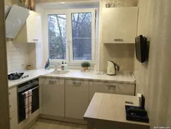 Photo small corner kitchens with a refrigerator by the window