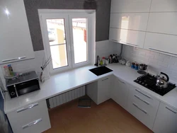 Photo small corner kitchens with a refrigerator by the window