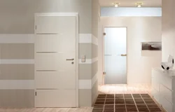 Glass doors to the bathroom and toilet photo