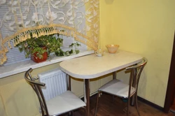 Dining table for a small kitchen against the wall photo