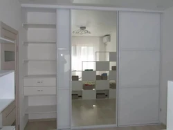 Wardrobe in the hallway white gloss with mirror photo