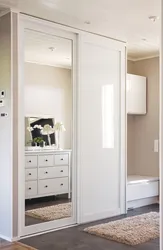 Wardrobe in the hallway white gloss with mirror photo