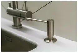Built-in detergent dispenser in the kitchen photo