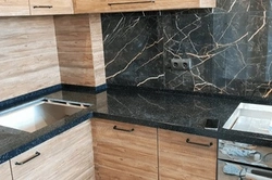 Wood-look stone countertop for kitchen photo