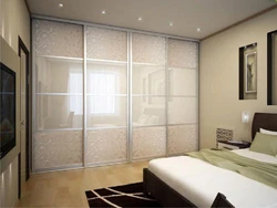 White wardrobe in the bedroom on the entire wall photo