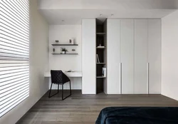 White wardrobe in the bedroom on the entire wall photo