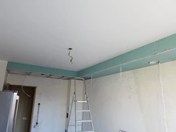Suspended ceiling in the kitchen with a gas pipe photo