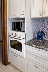 Kitchen oven and microwave in one cabinet photo