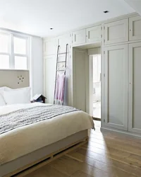 Photo Of Wardrobes In The Bedroom On The Entire Wall With A Bed