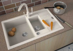 Sinks with a wing for the kitchen made of artificial stone photo