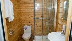 Bathroom in a country house in a wooden house photo with shower