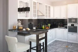 White kitchen with black countertop and bar counter photo