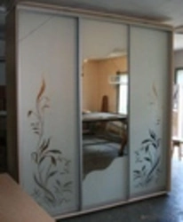 Photo Of Wardrobes In The Bedroom With A Pattern On One Mirror