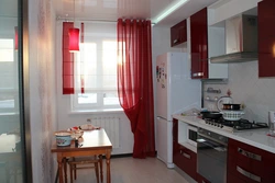 Burgundy curtains in the kitchen interior