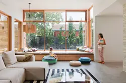 Living room interiors with wooden windows