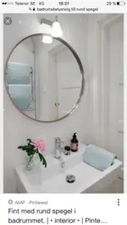 White mirror in the bathroom interior