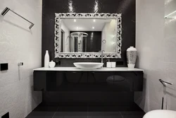 Black mirror in the bathroom interior