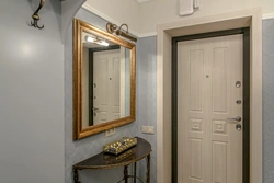 Hallway interior with door with mirror